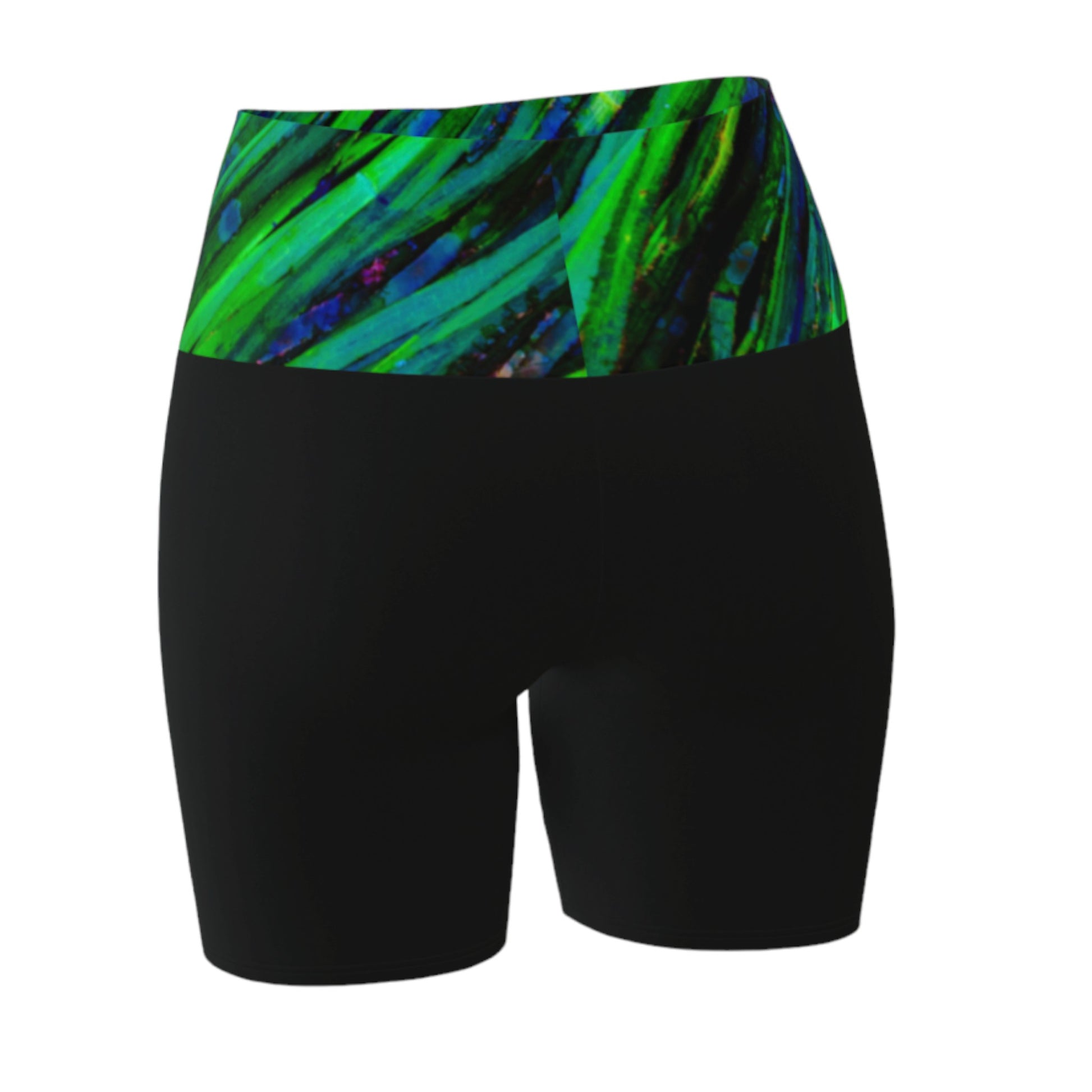 Shades of green yoga shorts features the image of spring green ocean sea grass at low tide. the rest of the shorts are black.