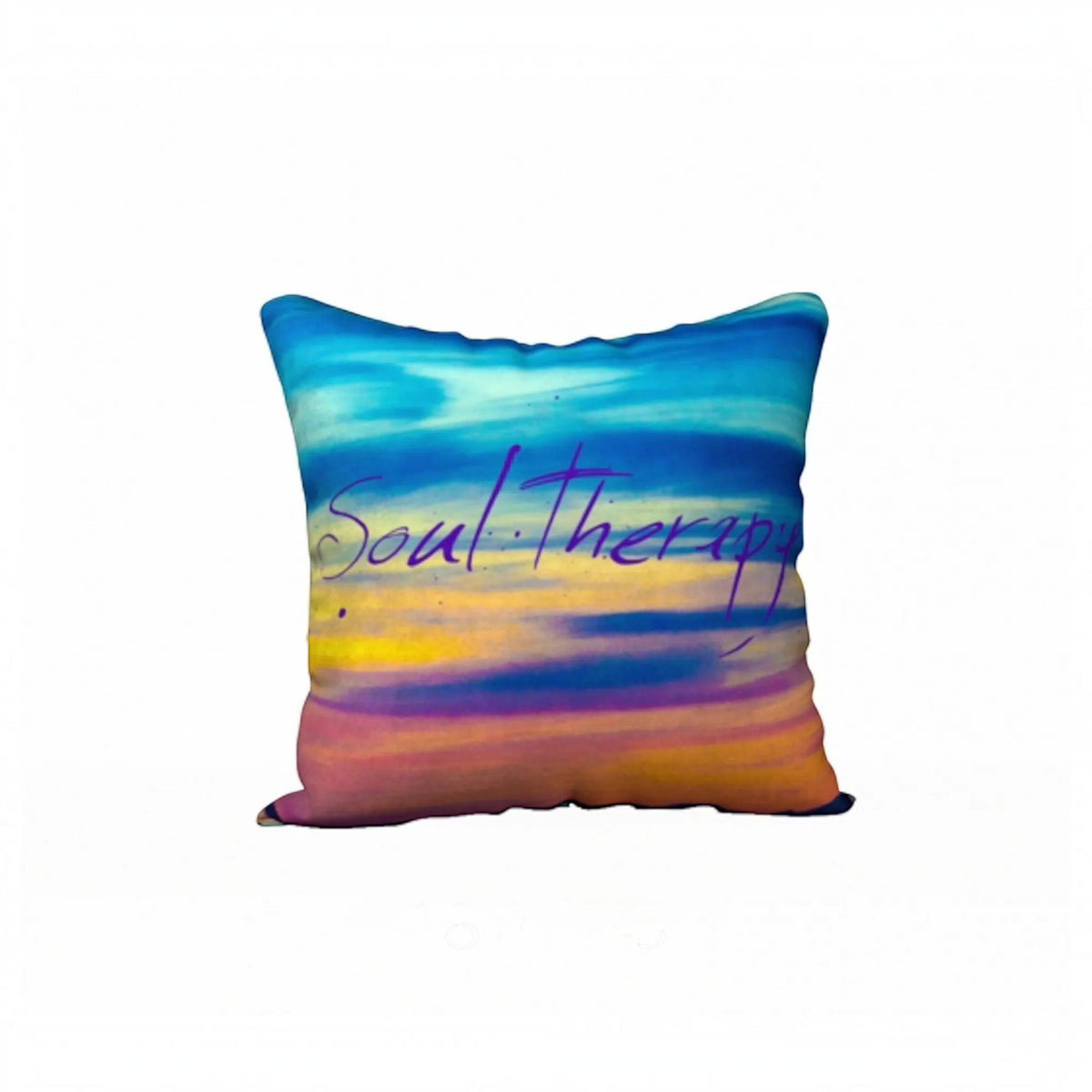 A square throw pillow featuring a colorful watercolor sunset design with blue, purple, yellow, and orange hues, and the words 'Soul Therapy' written across the center in purple script.