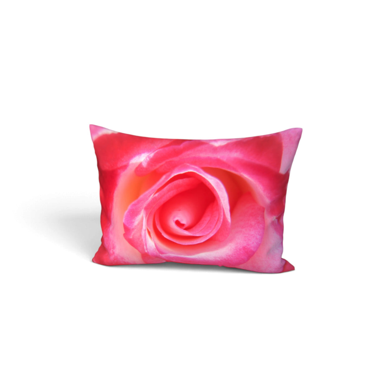A rectangular throw pillow featuring a close-up photographic print of a vibrant pink rose, shown against a plain white background.