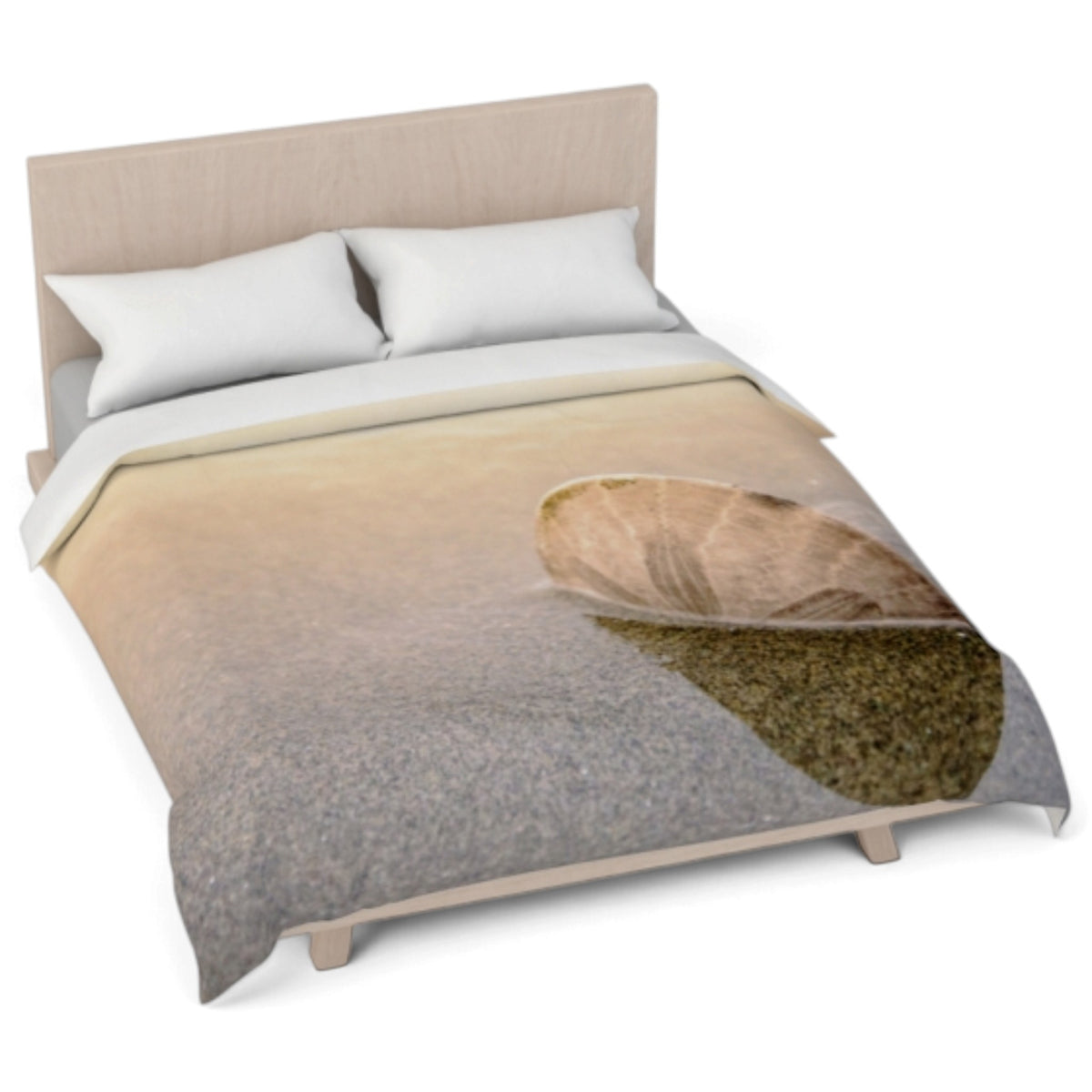 A bed dressed with a duvet cover featuring a realistic print of a wet leaf on water, shown with two white pillows and a light wood headboard against a white background.