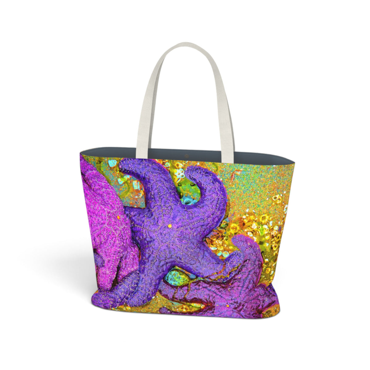 A tote bag with a colorful abstract design featuring a prominent purple starfish on a gold and green background, with white shoulder straps and a dark gray interior, shown on a plain white background.