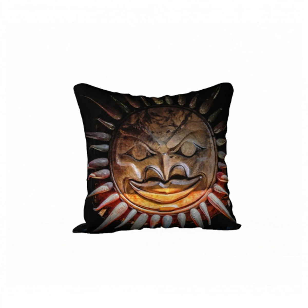 A square throw pillow featuring a detailed graphic print of a carved wooden sun mask with a menacing expression, set against a plain white background.