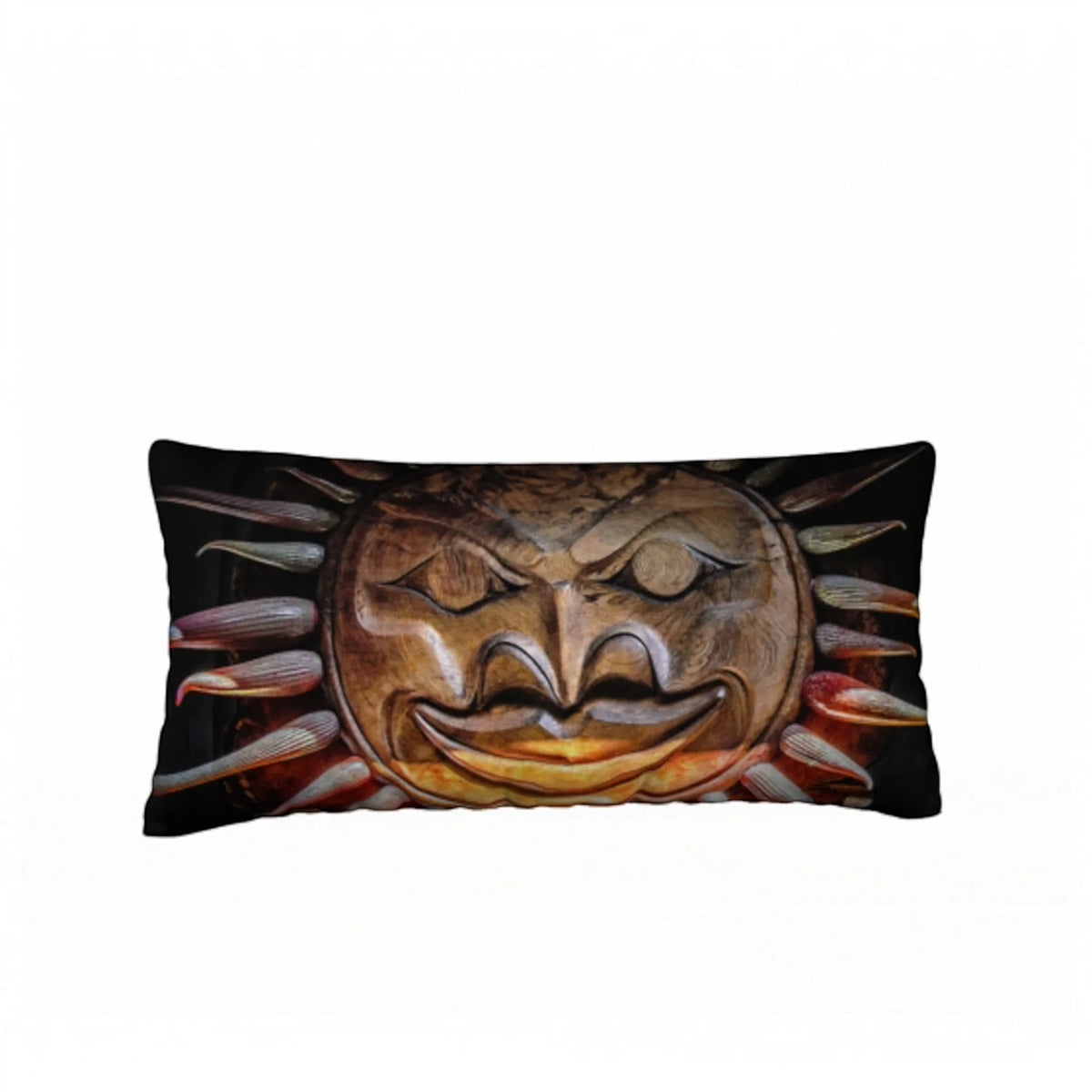 A rectangular lumbar throw pillow featuring a printed graphic of a carved wooden sun mask with stylized rays, set against a plain white background.