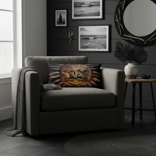 A gray upholstered armchair in a styled living room, featuring a square throw pillow with a colorful carved mask design. The room has a dark gray shiplap wall with framed black-and-white ocean photographs, a round mirror, and a small side table.