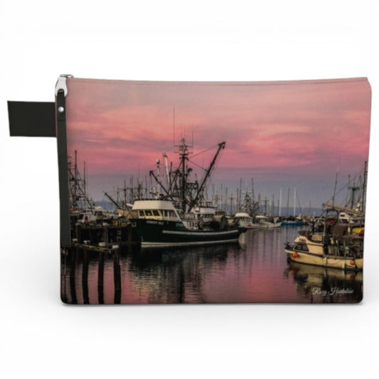 Pouch with a scenic design of a harbor at sunset.