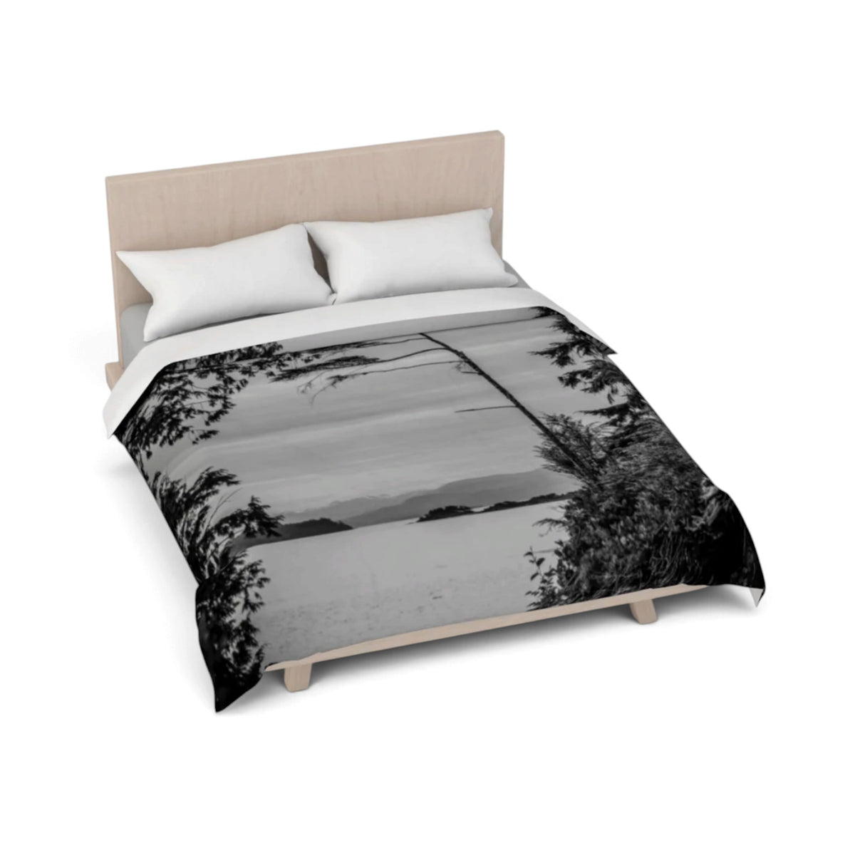 A bed dressed with a black-and-white landscape print comforter or duvet, shown on a light wood bed frame with two white pillows against a plain white background.