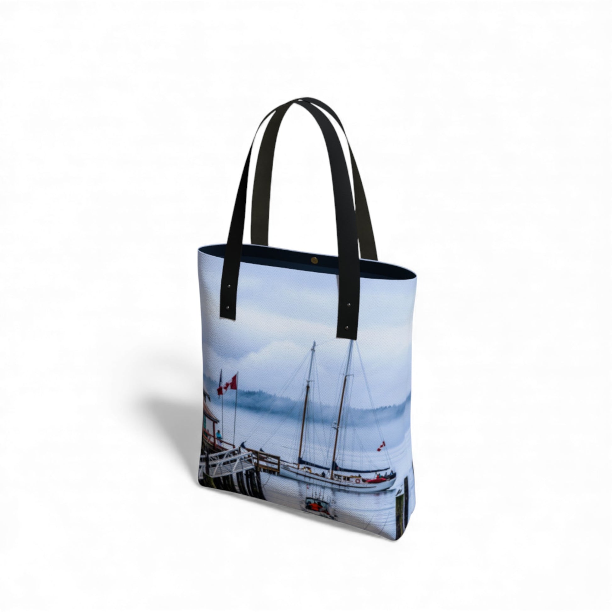 Tote bag with a sailboat design on a white background