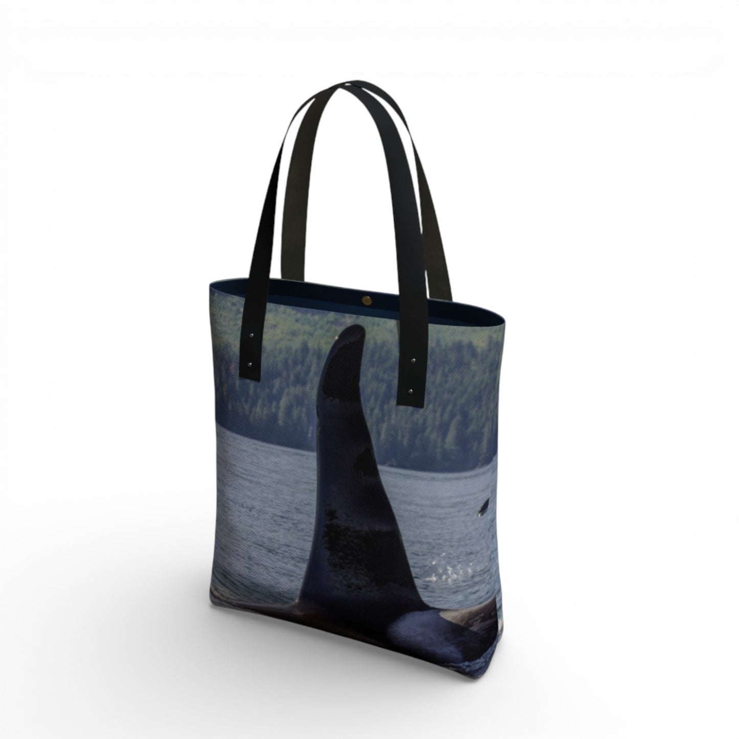 Tote bag with a design of a whale and ocean on a white background