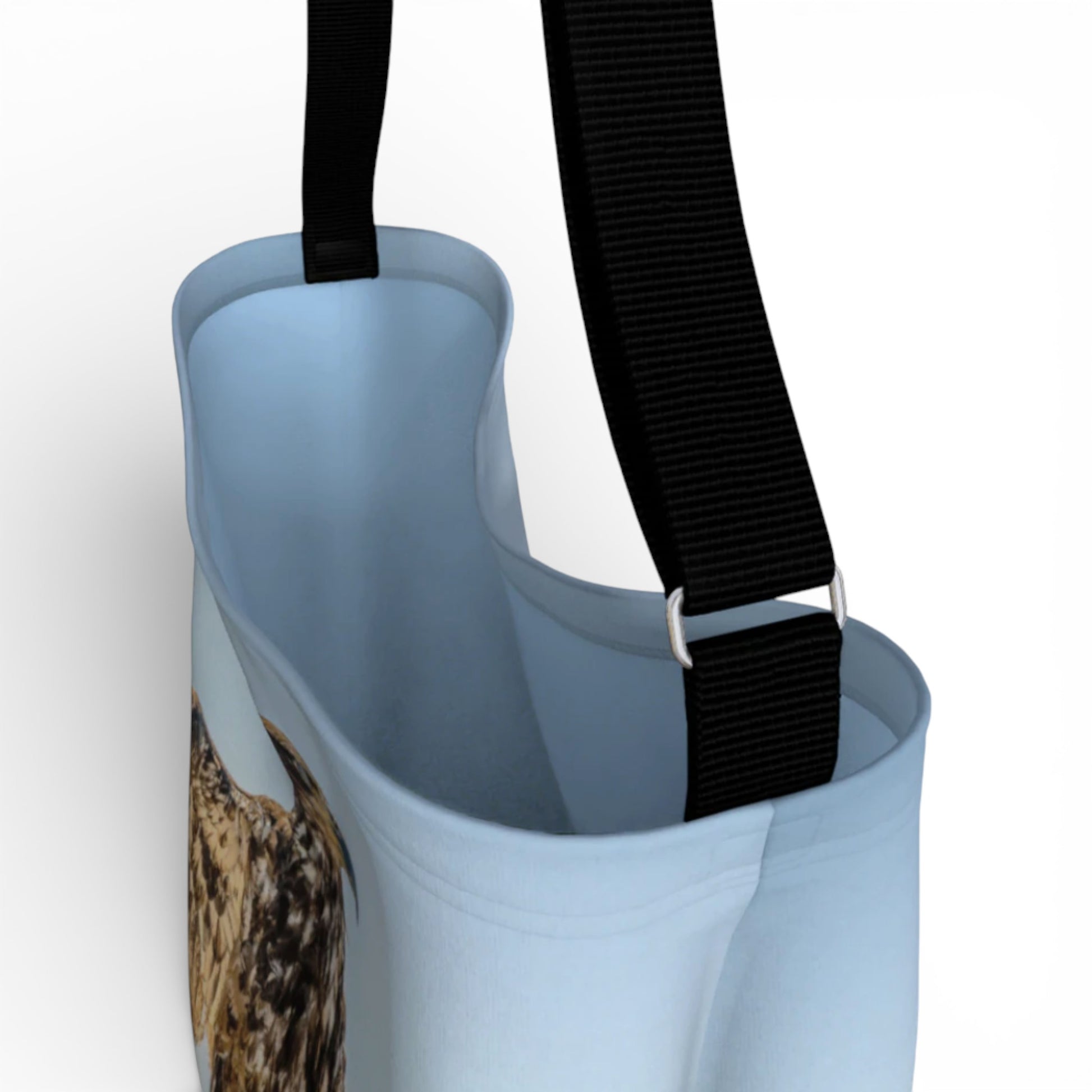 Light blue bag with a black strap on a white background