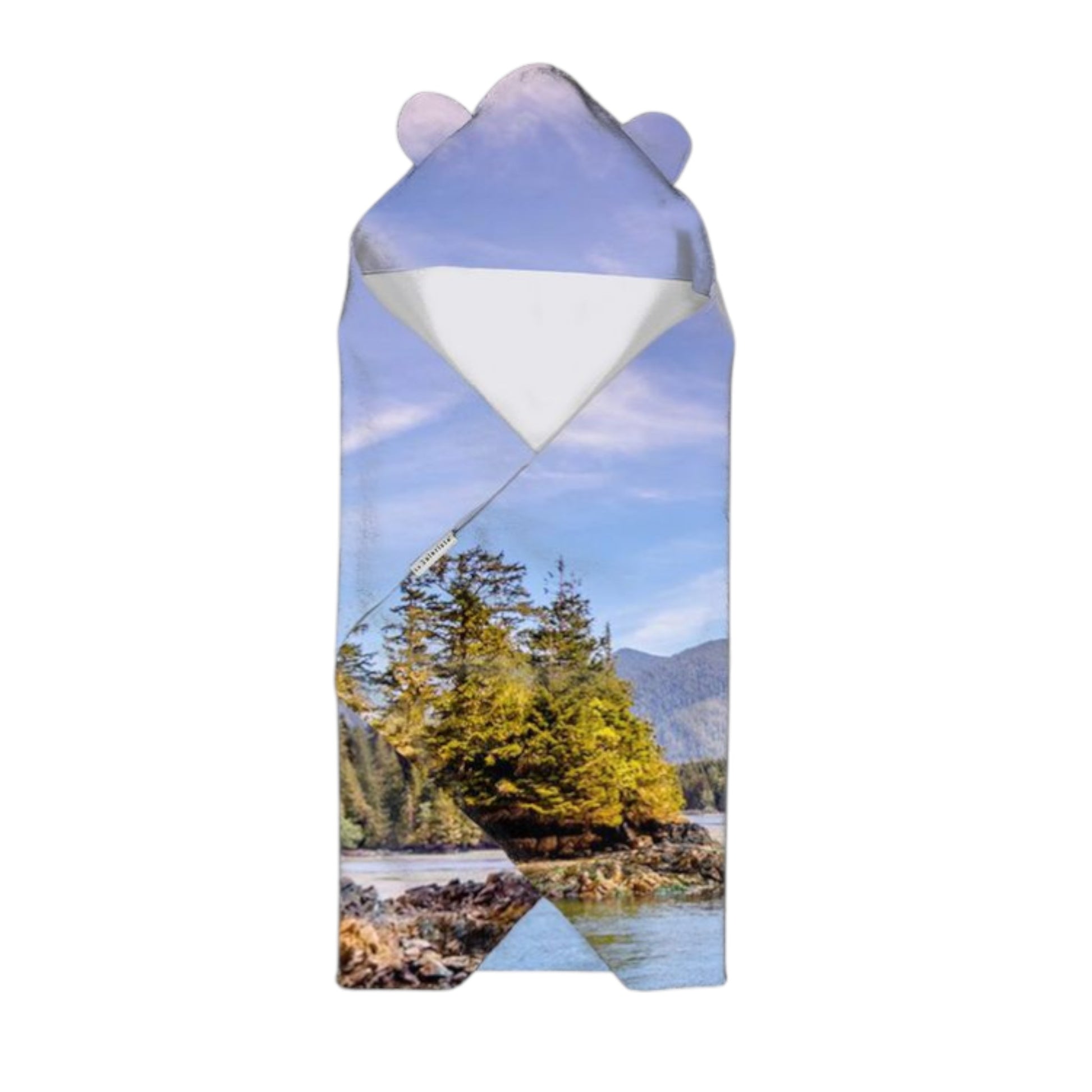 Product packaging with a scenic design of trees and water on a white background