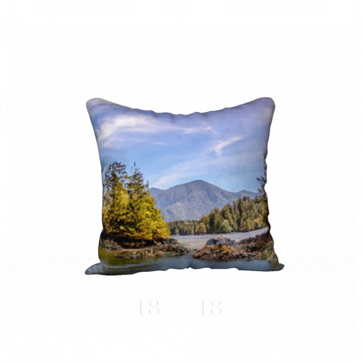 A square decorative throw pillow featuring a scenic landscape print of a river, evergreen trees, and mountains under a blue sky, shown against a plain white background.