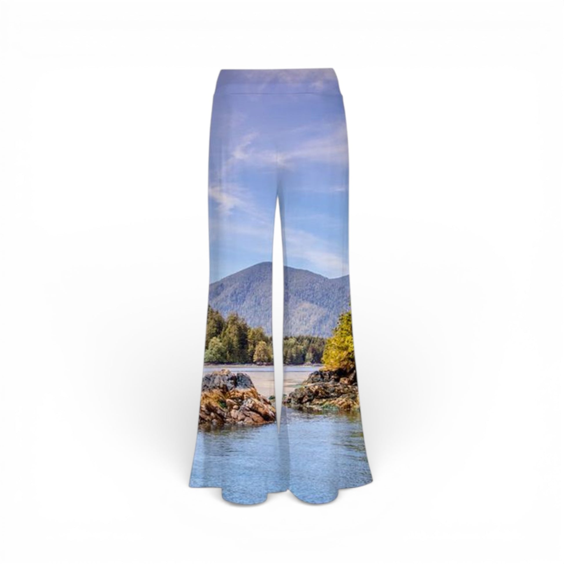 Pants with a scenic print of a ocean and mountains on a white background