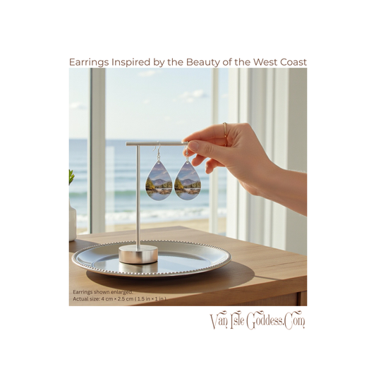 Earrings inspired by the West Coast held by a hand with a scenic background