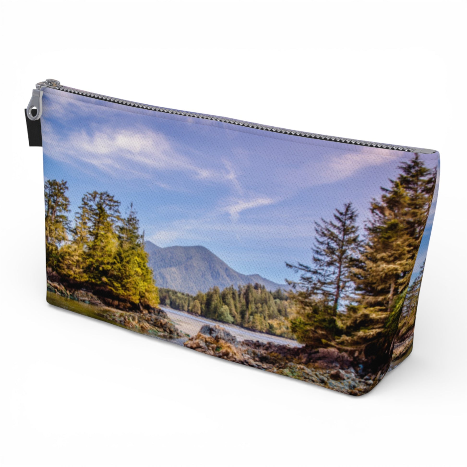 Pouch with a scenic design of a mountain and trees on a white background