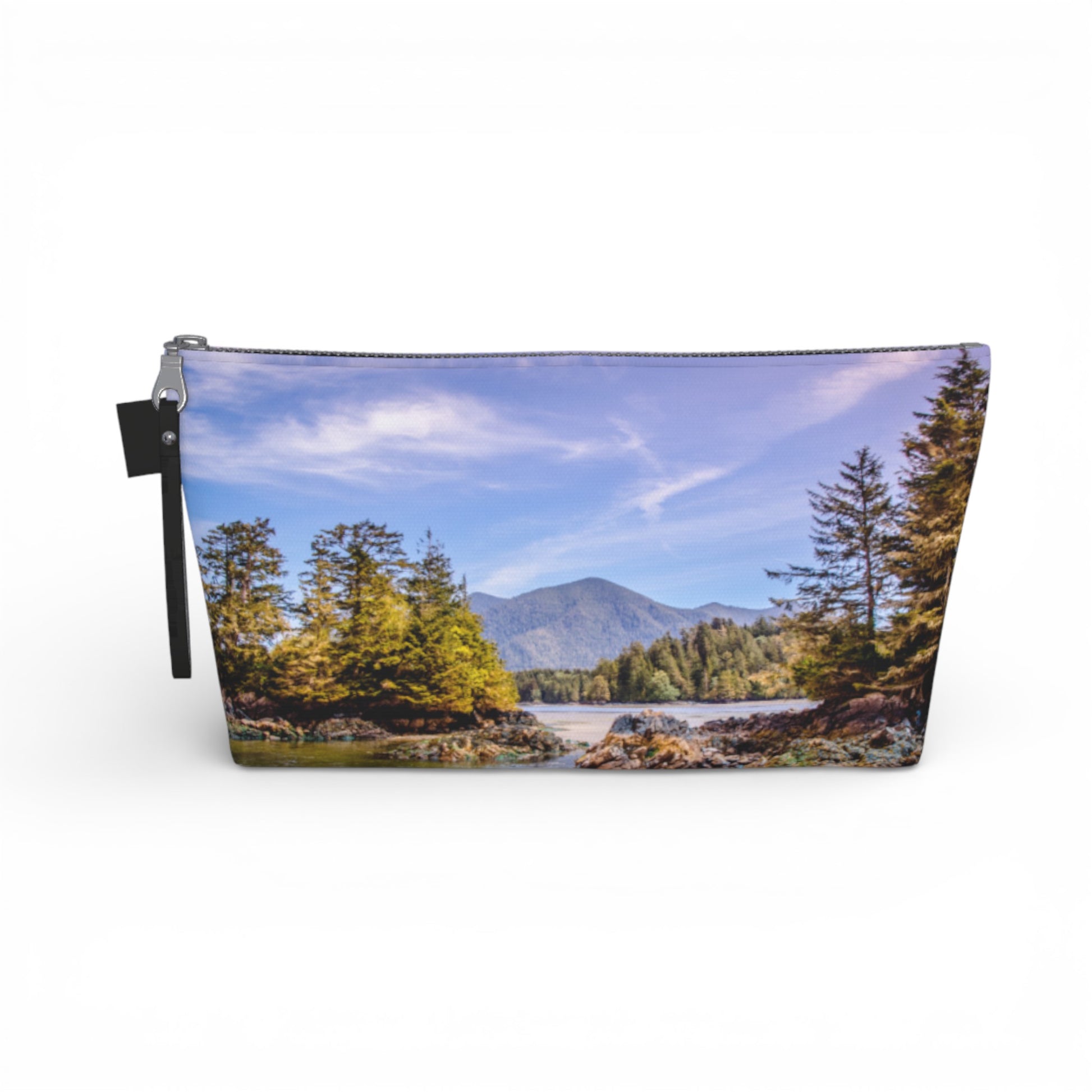 Pouch with a scenic design of trees and mountains on a white background
