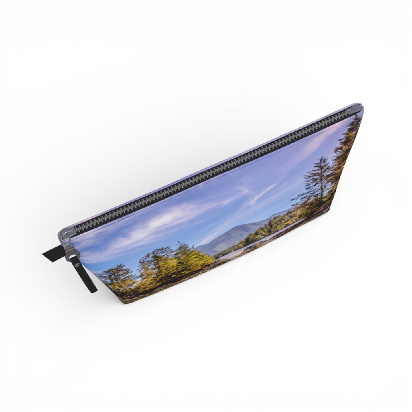 Pencil case with a scenic design of trees and mountains on a white background