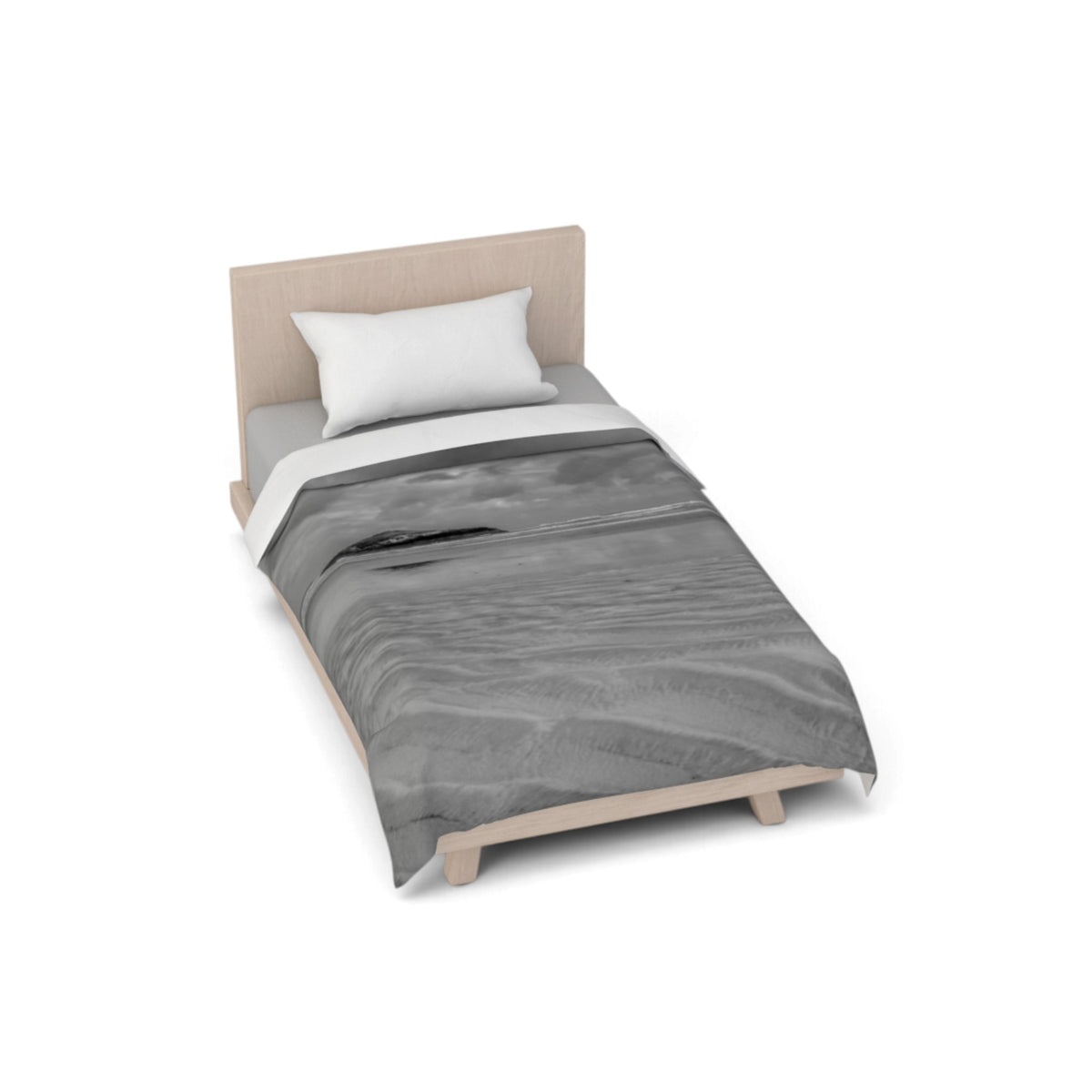 A single bed with a light wood frame and upholstered headboard, dressed in a gray abstract-printed comforter and a white pillow, shown on a plain white background.