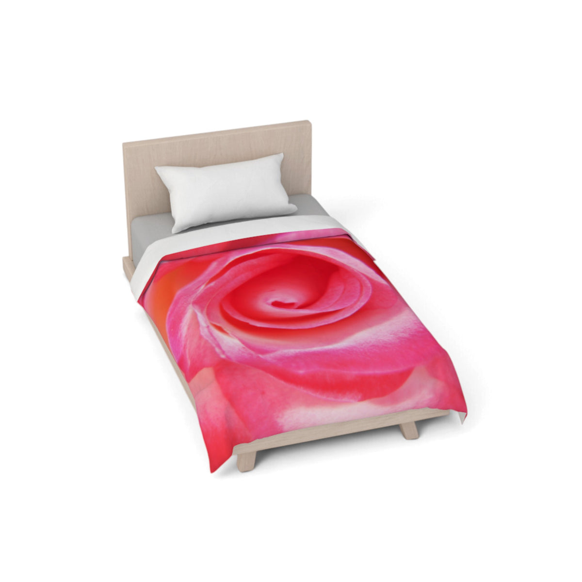 A single bed with a light wood frame and a white pillow, shown on a plain white background. The bed is dressed in a duvet cover featuring a large, vibrant pink and red rose print.