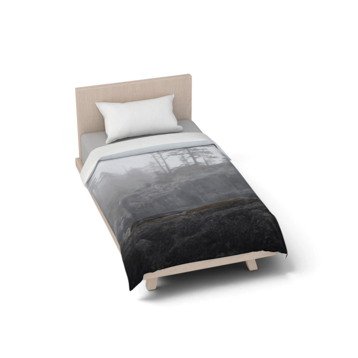 A single bed with a light wood frame and a white pillow, shown on a clean white background. The bed is dressed in a gray and black forest-themed comforter with a white top sheet.