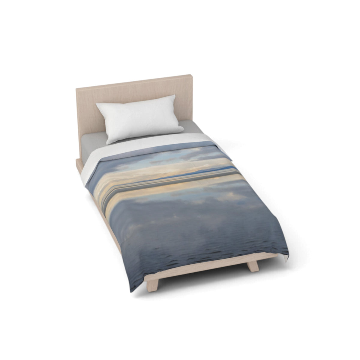A single bed with a light wood frame and upholstered headboard, styled with a white pillow and a duvet cover featuring an abstract landscape print in shades of blue, beige, and gray. The bed is shown from an elevated angle on a clean white background.