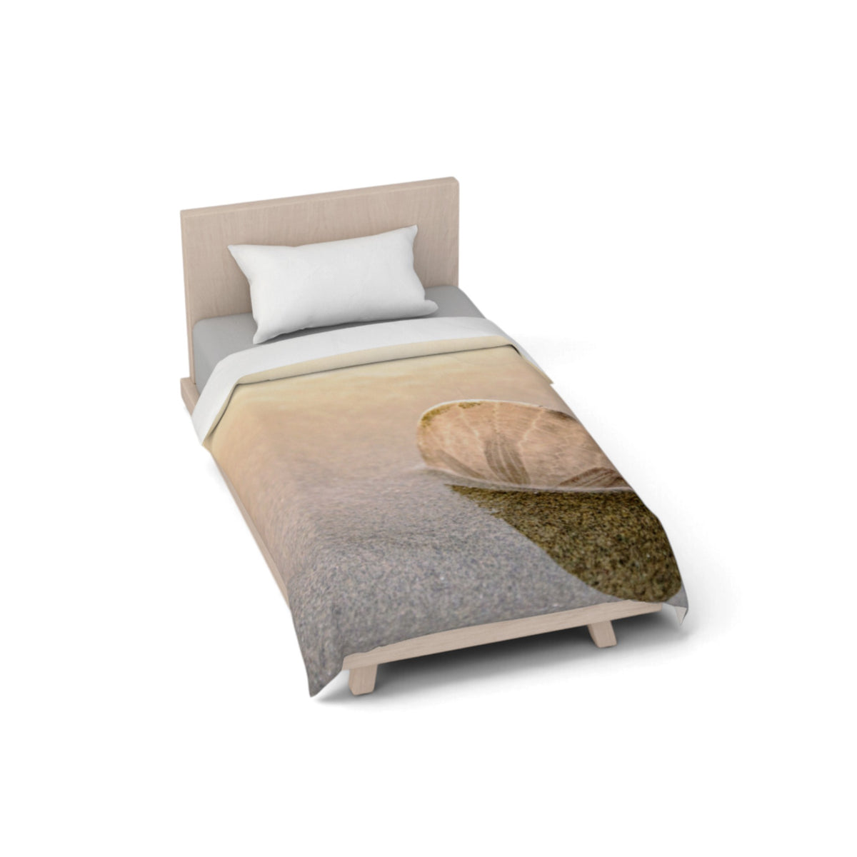 A single bed with a light wood headboard and legs, dressed in a duvet cover featuring a split design of textured gray and a warm beige-and-brown landscape with a large shell motif, shown on a white background.