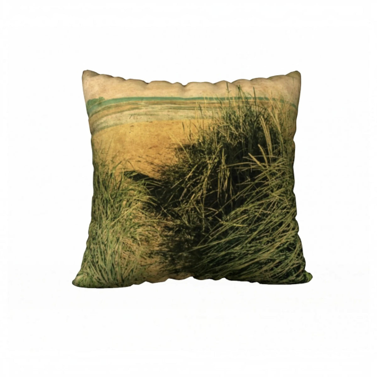 A square decorative throw pillow featuring a vintage-style printed beach dune scene with tall green grasses and a sandy shoreline under a muted sky, shown on a plain white background.