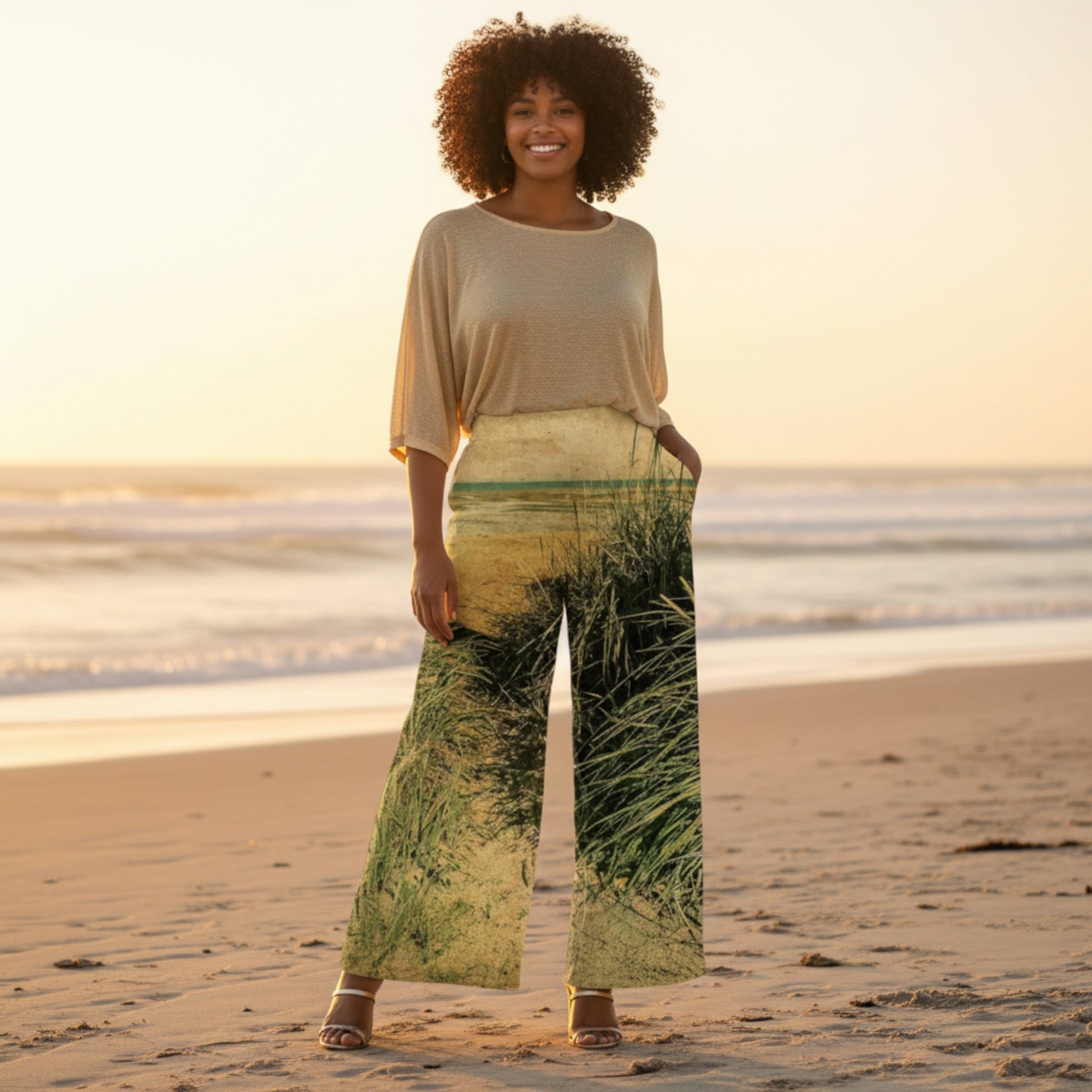 Woman standing on a beach with a scenic background