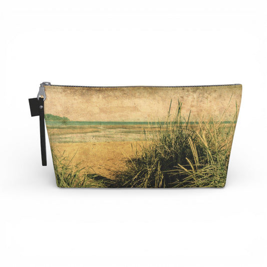 Pouch with a beach scene design featuring sand and grass on a white background