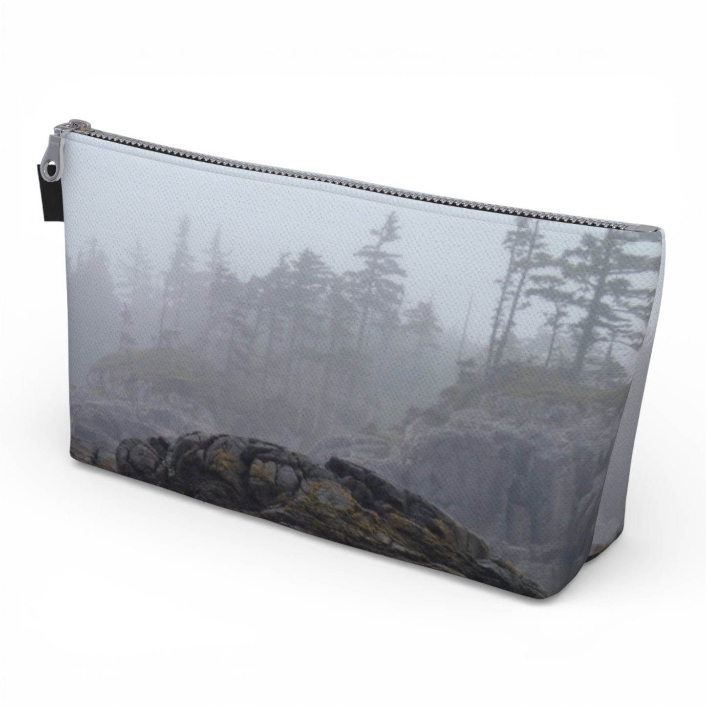 Pouch with a nature-themed design of trees and rocks on a white background