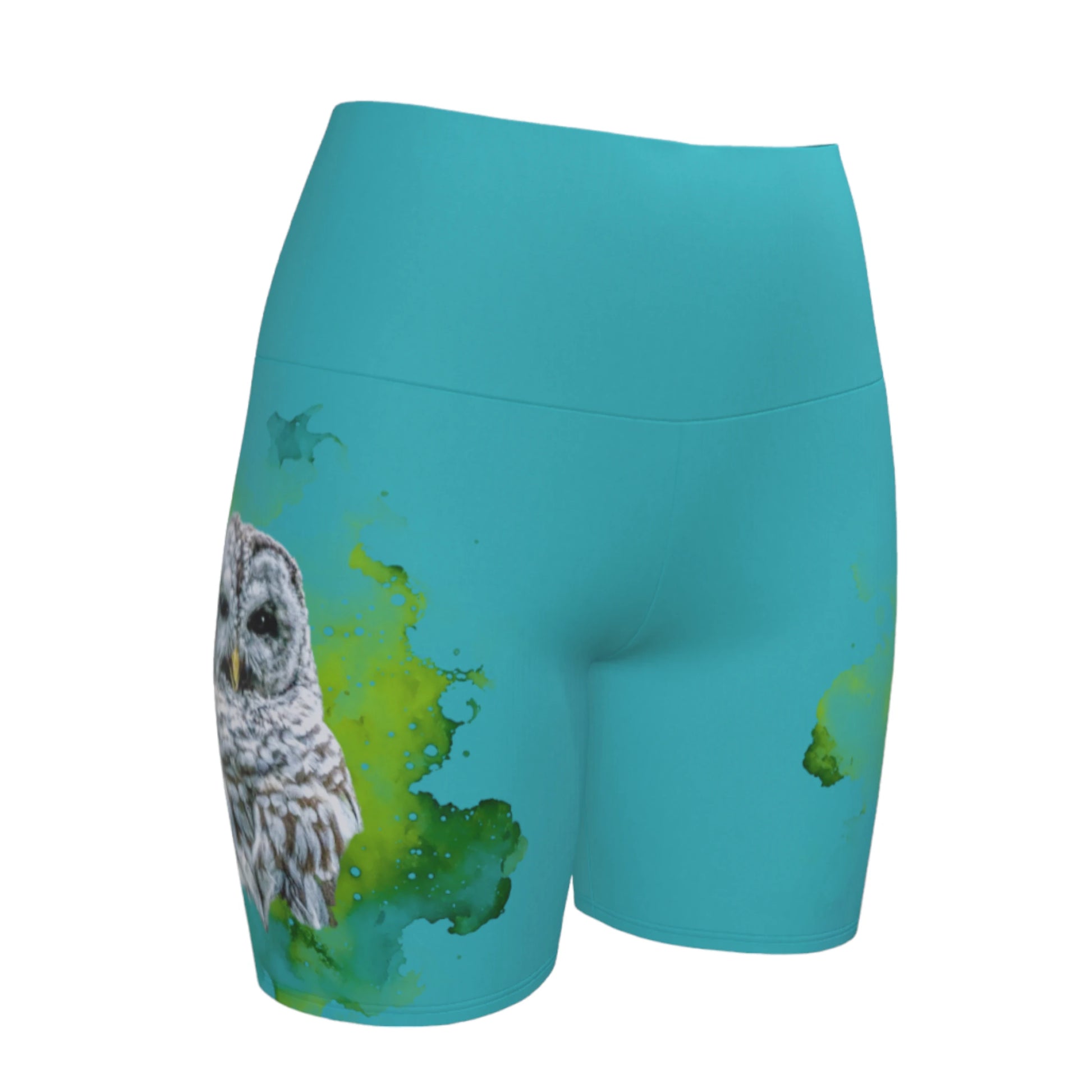 Wise owl yoga shorts features a barred owl printed on the shorts.  The rest of the shorts is turquoise in colour.