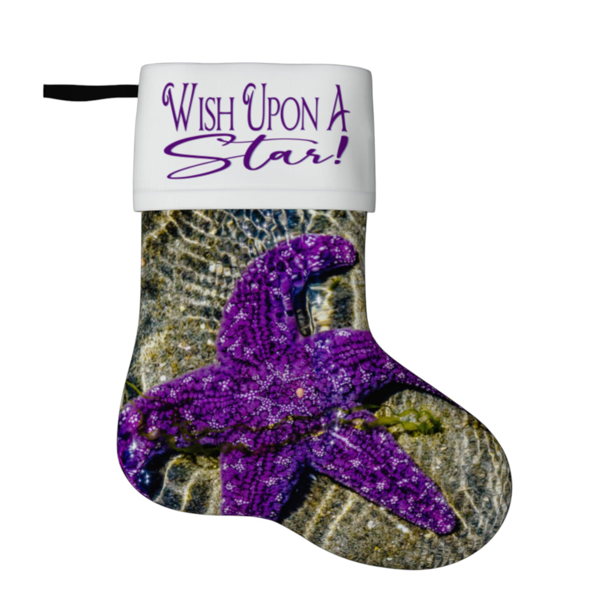 A Christmas stocking featuring a purple glitter starfish on a textured ocean floor print, with a white cuff printed with the purple text 'Wish Upon A Star!'.