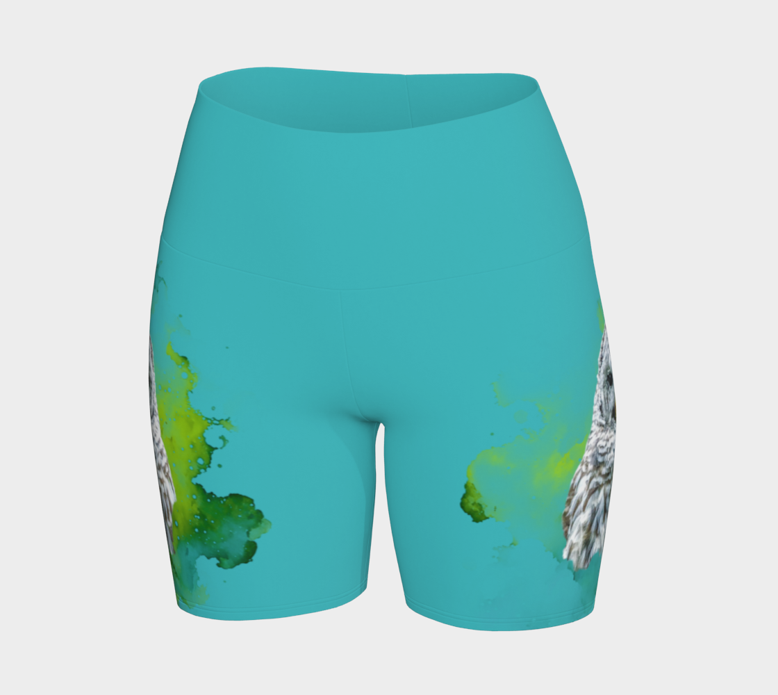 Wise owl yoga shorts features a barred owl printed on the shorts.  The rest of the shorts is turquoise in colour.