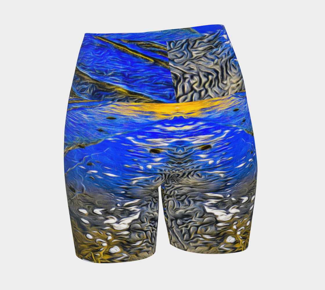 Ebb and Flow All over print yoga shorts.  The shorts feature a image of the ocean water at low tide on Parksville Beach.  the blue sky and the sun is reflecting on the water as the waves gently ripple across the sand.  A painterly effect was added to create a artistic effect.
