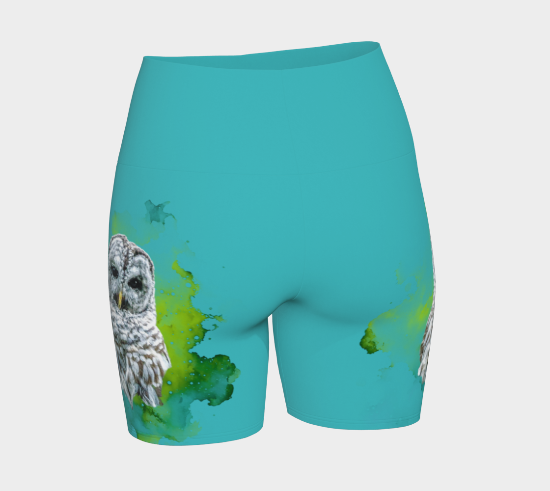 Wise owl yoga shorts features a barred owl printed on the shorts.  The rest of the shorts is turquoise in colour.