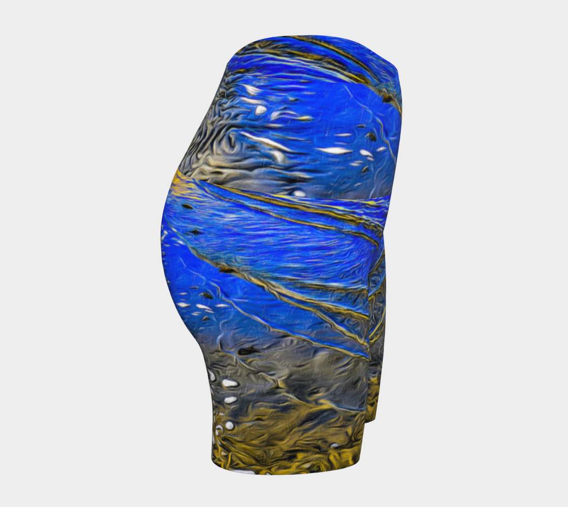 Ebb and Flow All over print yoga shorts.  The shorts feature a image of the ocean water at low tide on Parksville Beach.  the blue sky and the sun is reflecting on the water as the waves gently ripple across the sand.  A painterly effect was added to create a artistic effect.