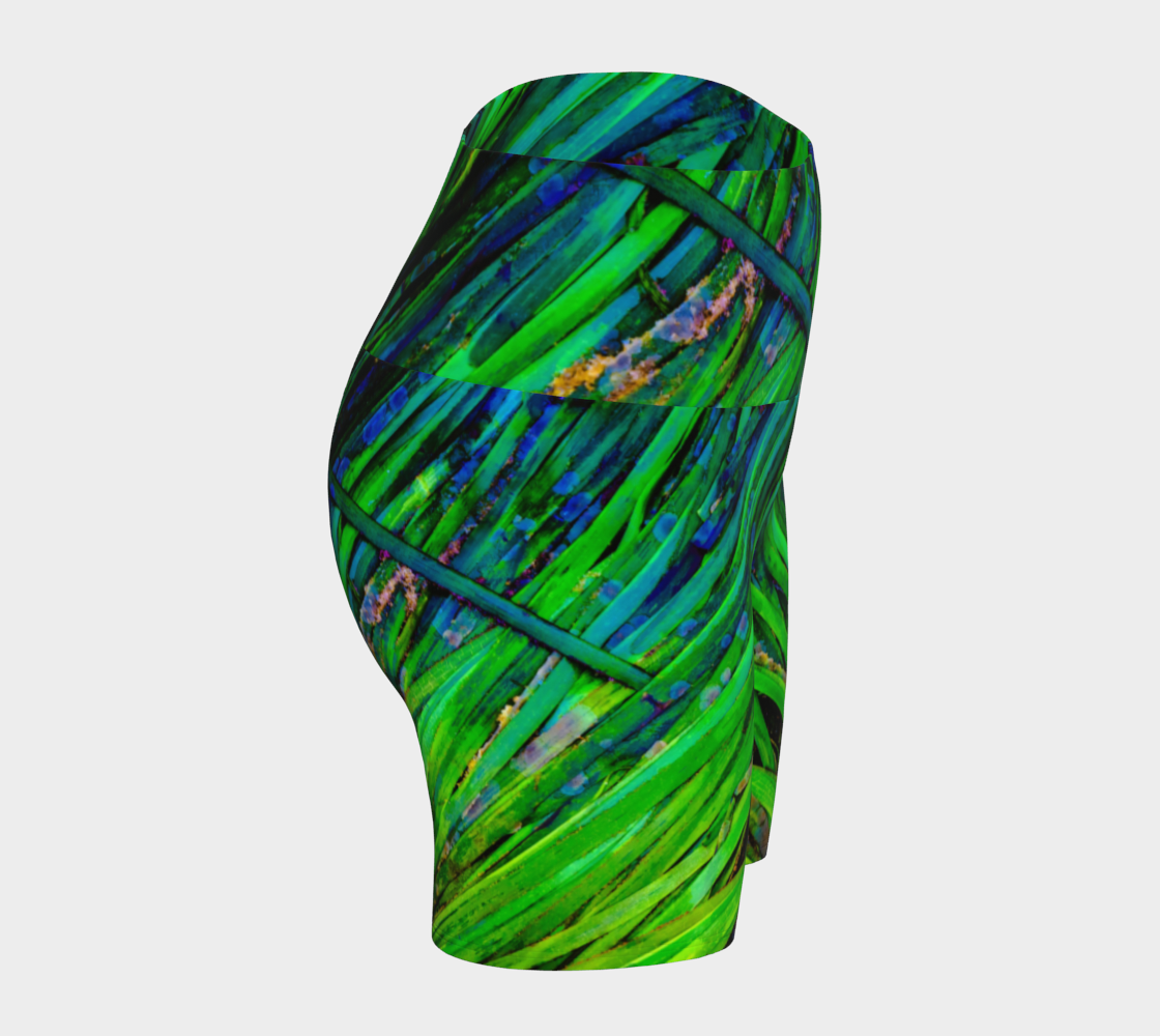 Shades of green yoga shorts feature an all over print of spring ocean sea grass at low tide.
