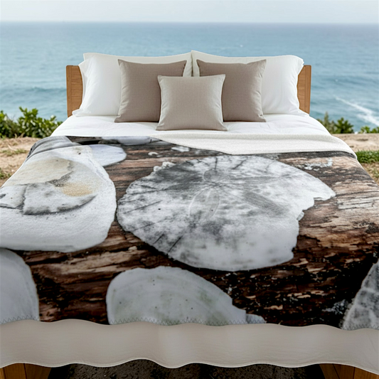 Van Isle Goddess Miracle Beach coastal blanket with sand dollars and seashells on wood grain. Double-thick minky polyester.