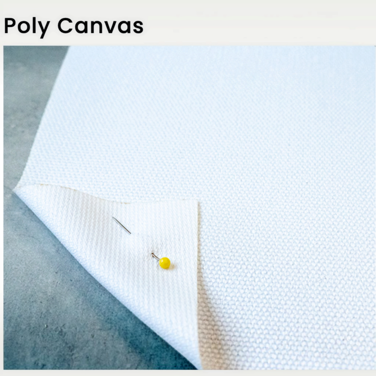 Van Isle Goddess poly canvas fabric texture detail for throw pillow cover with a corner folded back and yellow pin