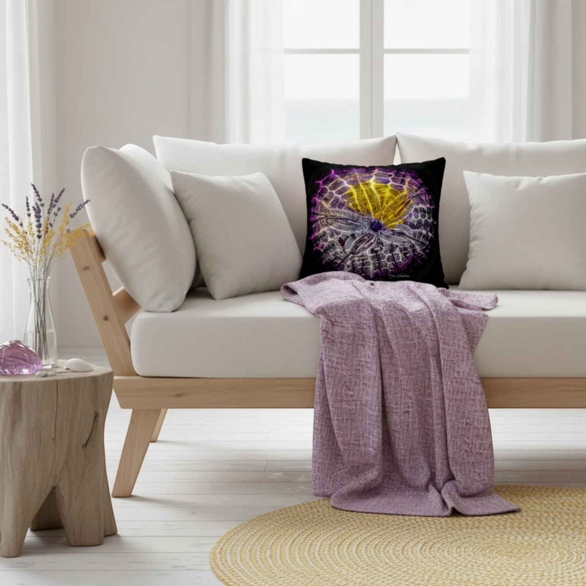 Van Isle Goddess Spotlight Sand Dollar throw pillow cover on a modern white sofa in a bright, coastal-style living room
