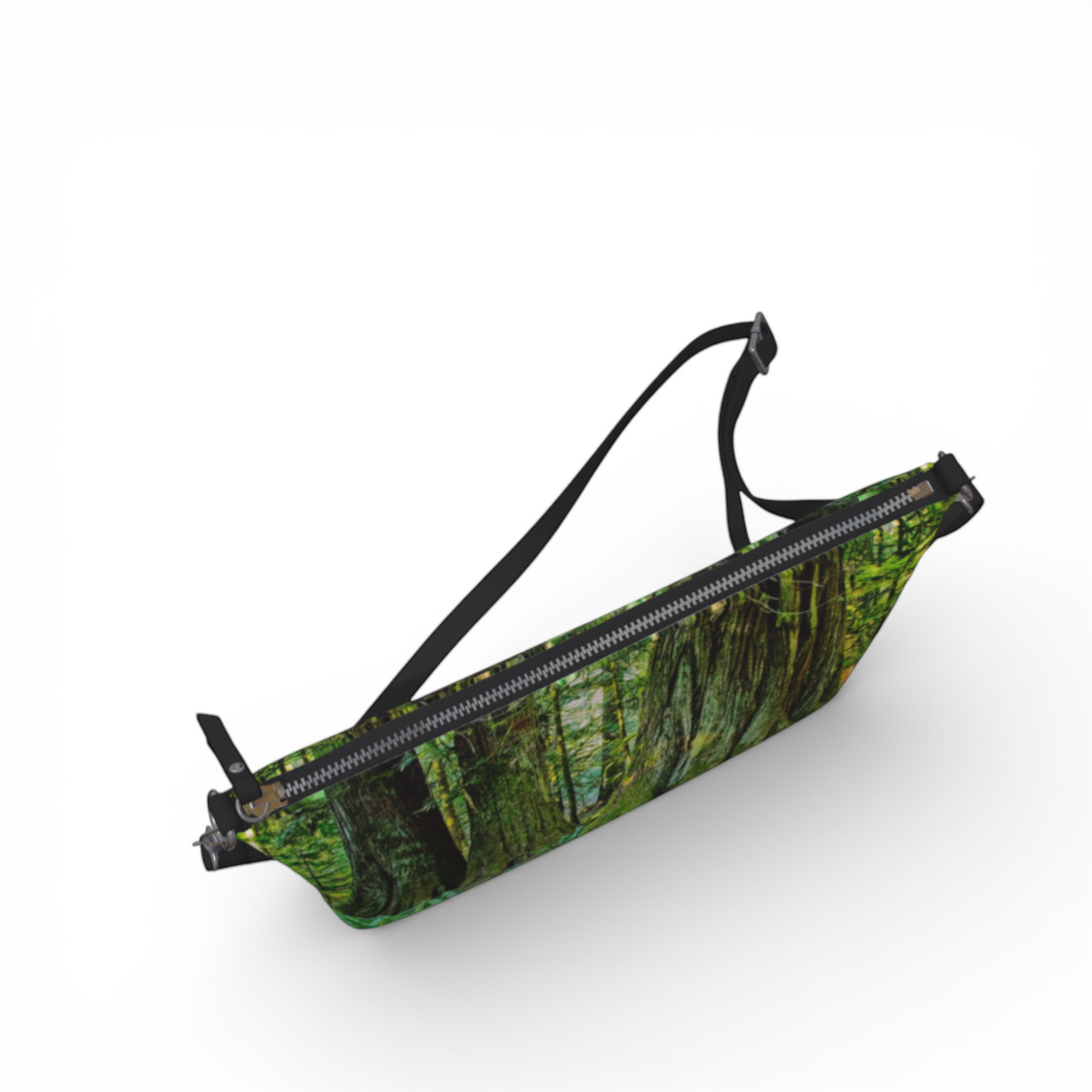 Van Isle Goddess crossbody purse with a forest print, adjustable strap, and metal zipper. Made from vegan leather.