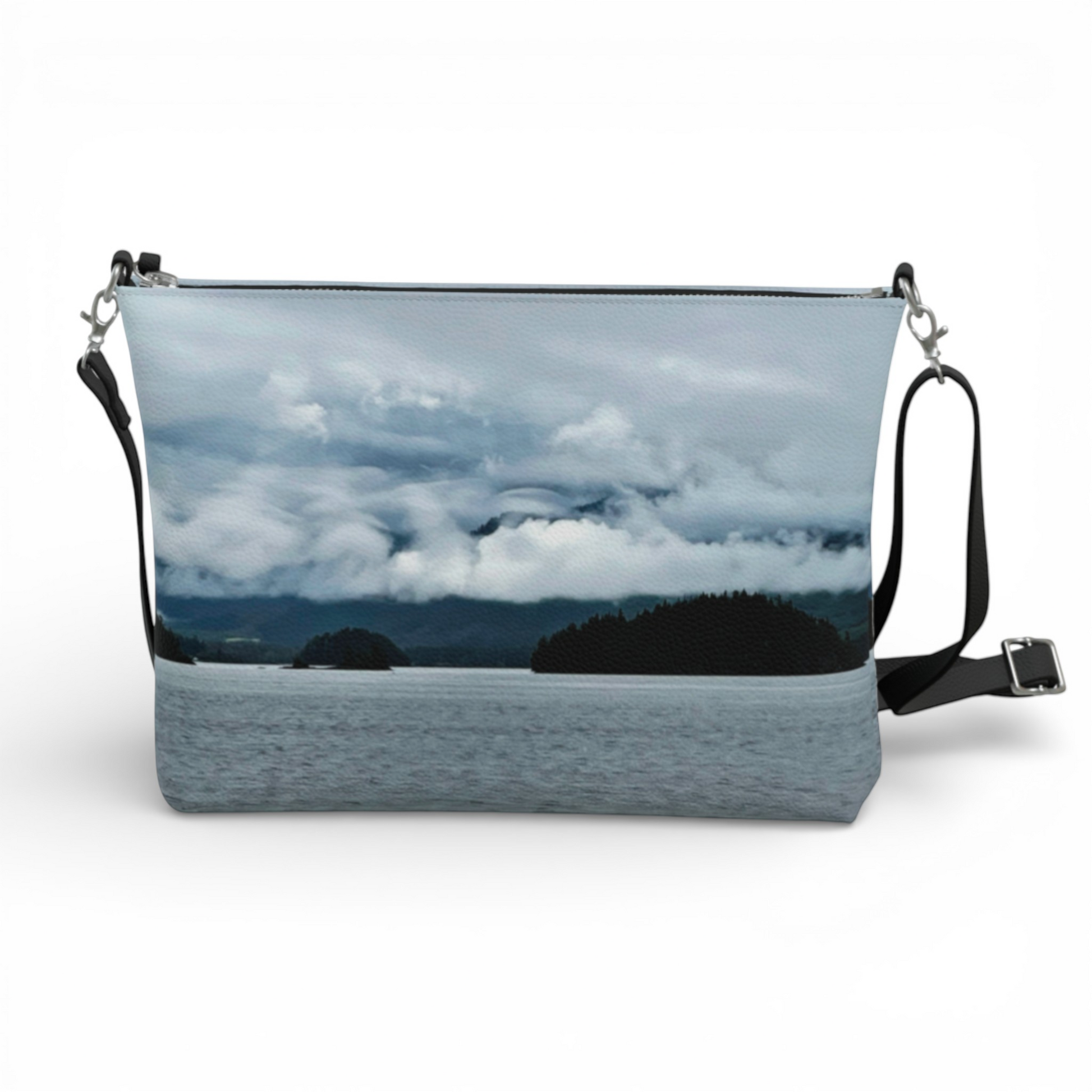 Van Isle Goddess Alberni Inlet crossbody purse with a cloudy, mountainous landscape print. Vegan leather with adjustable strap.