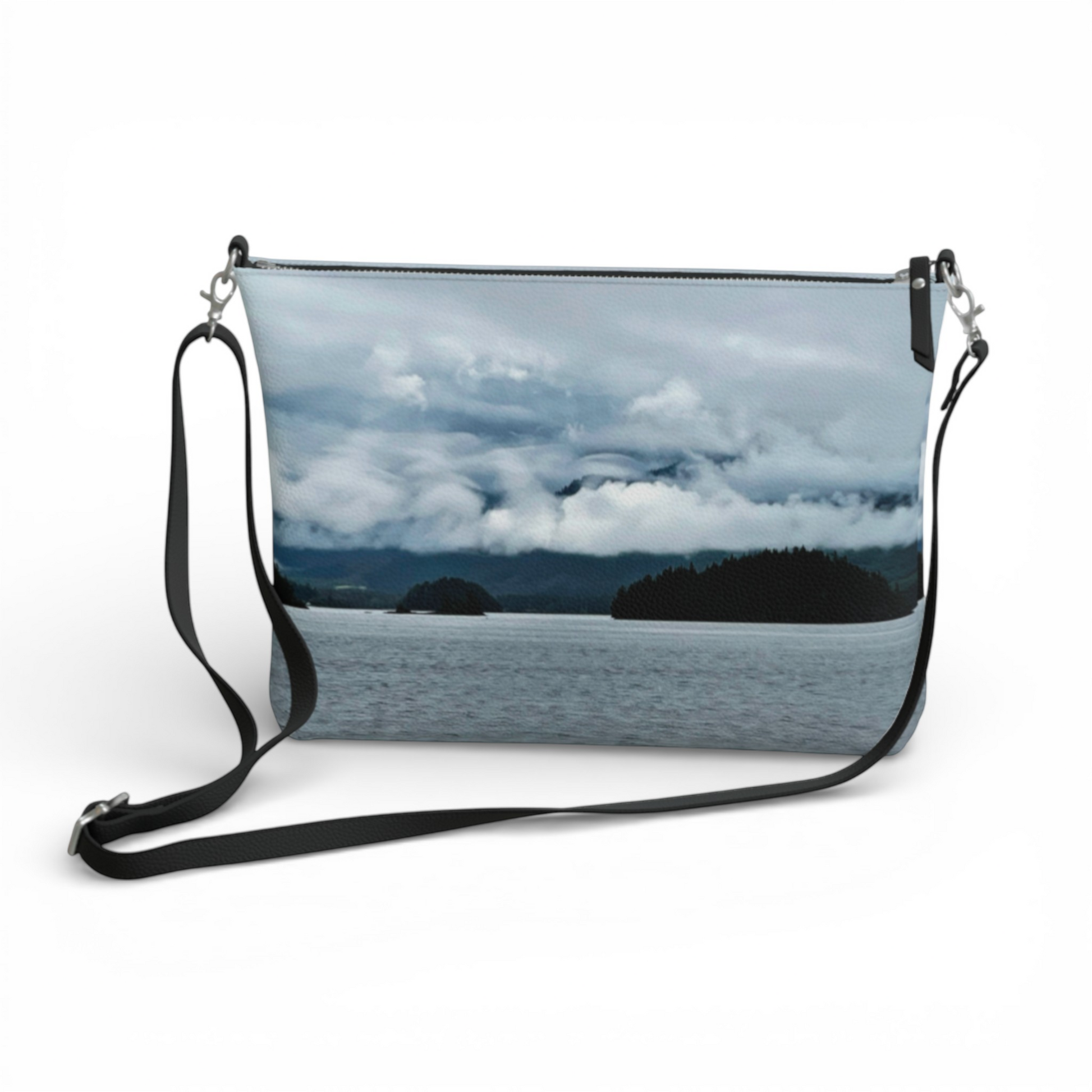 Van Isle Goddess Alberni Inlet crossbody purse with a scenic water and cloudy sky print, made of vegan leather.