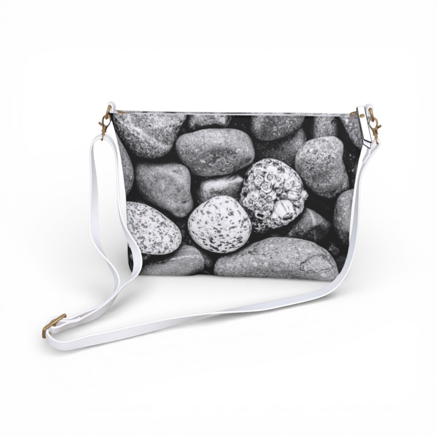 Van Isle Goddess Beach Rocks vegan leather crossbody purse with adjustable white strap and pebble texture.