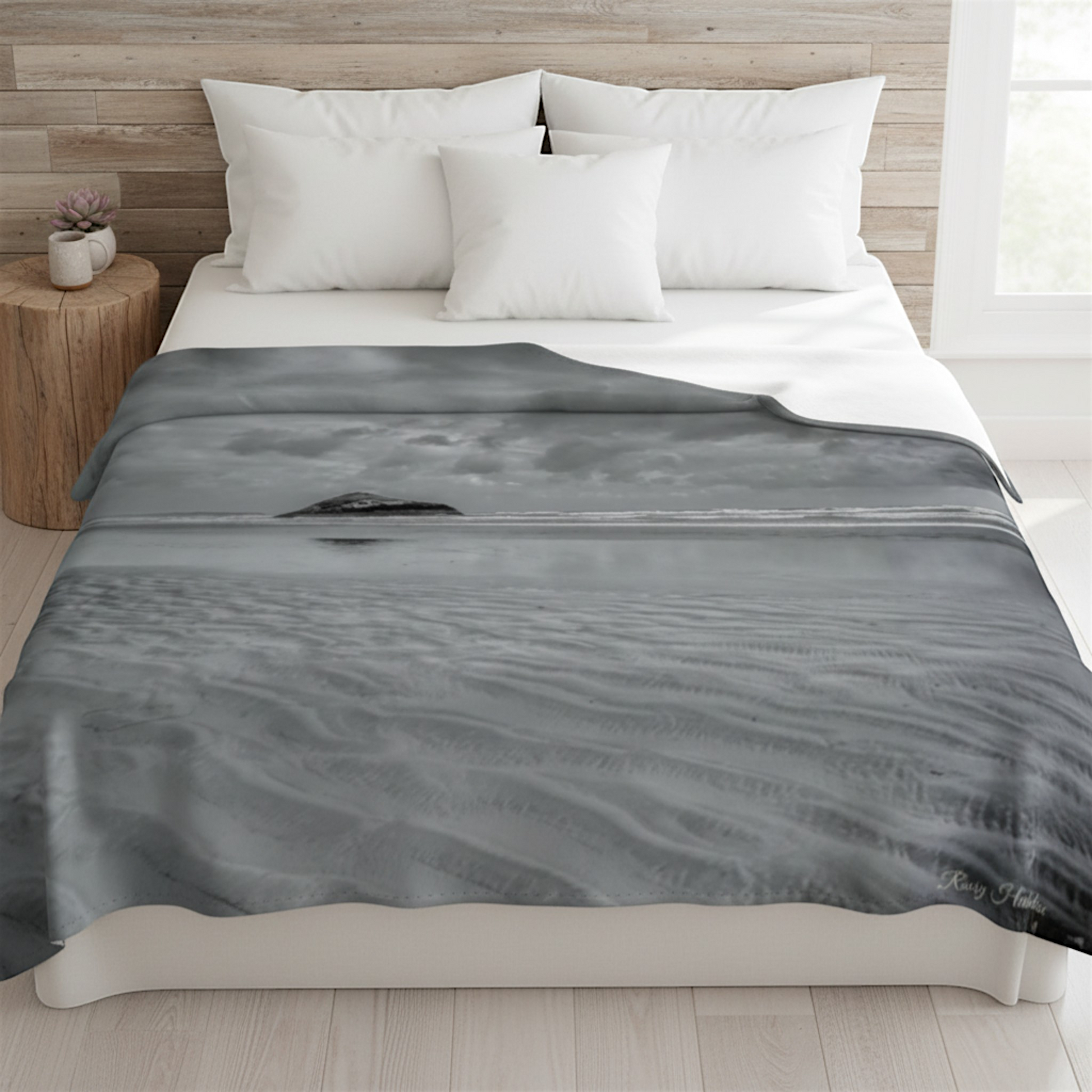 Van Isle Goddess Long Beach Tofino Coastal Blanket, featuring a black and white photograph of Lovekin Rock under a cloudy sky.