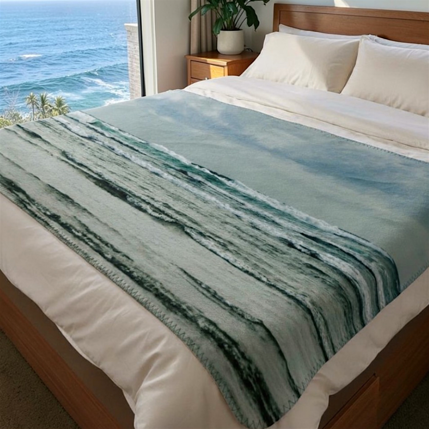 Van Isle Goddess Ocean Calling Long Beach Tofino Coastal Blanket, featuring turquoise waves and a cloudy sky. Made of soft polyester minky fabric.