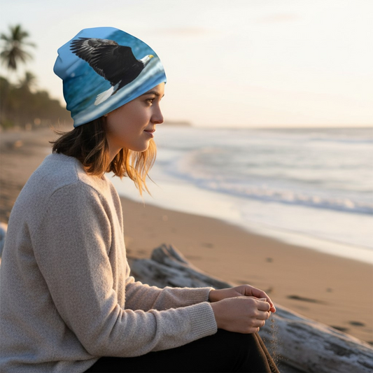 Van Isle Goddess beanie with a bald eagle in flight over blue water, polyester-spandex blend with bamboo lining.