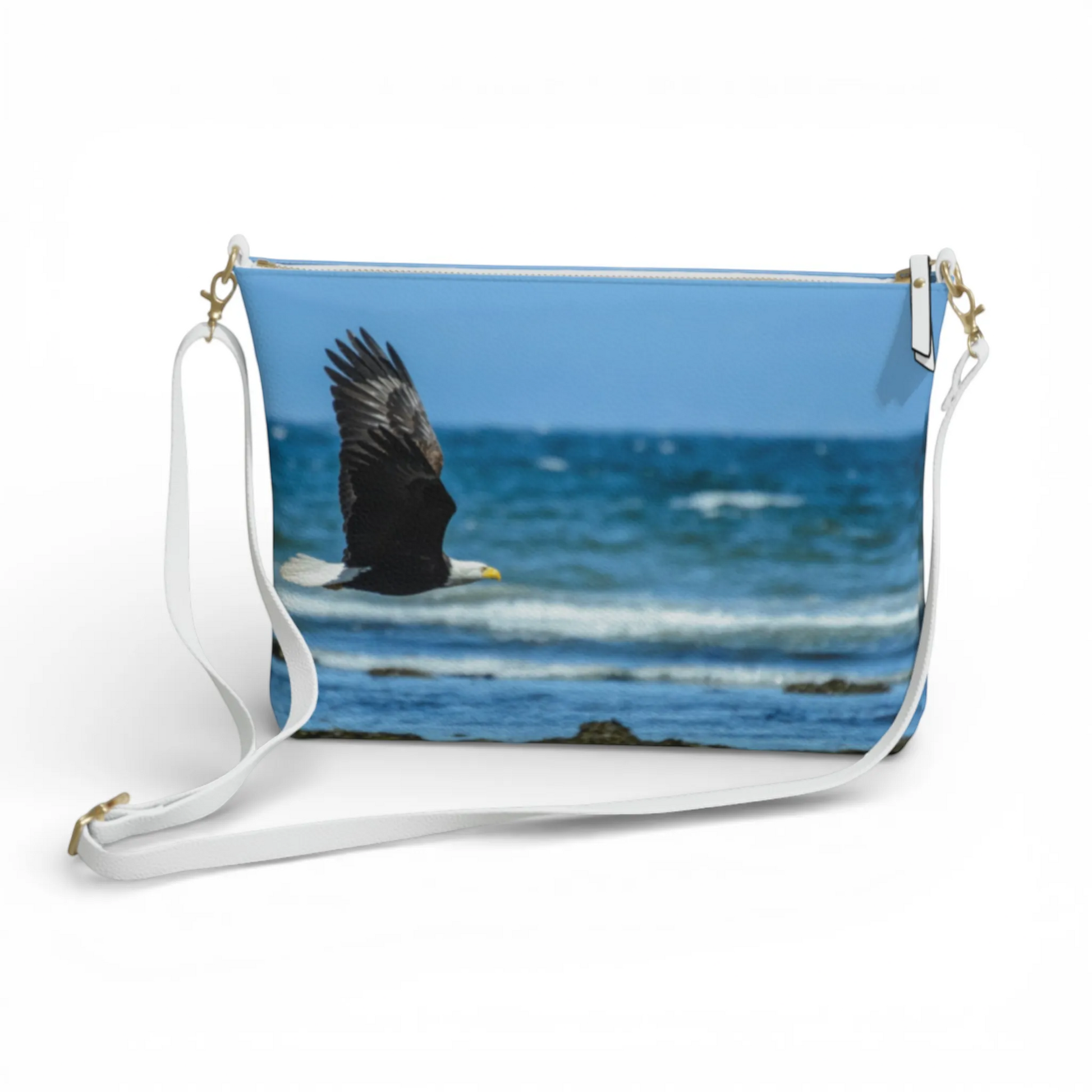 Van Isle Goddess vegan leather crossbody purse with a bald eagle in flight over the ocean.