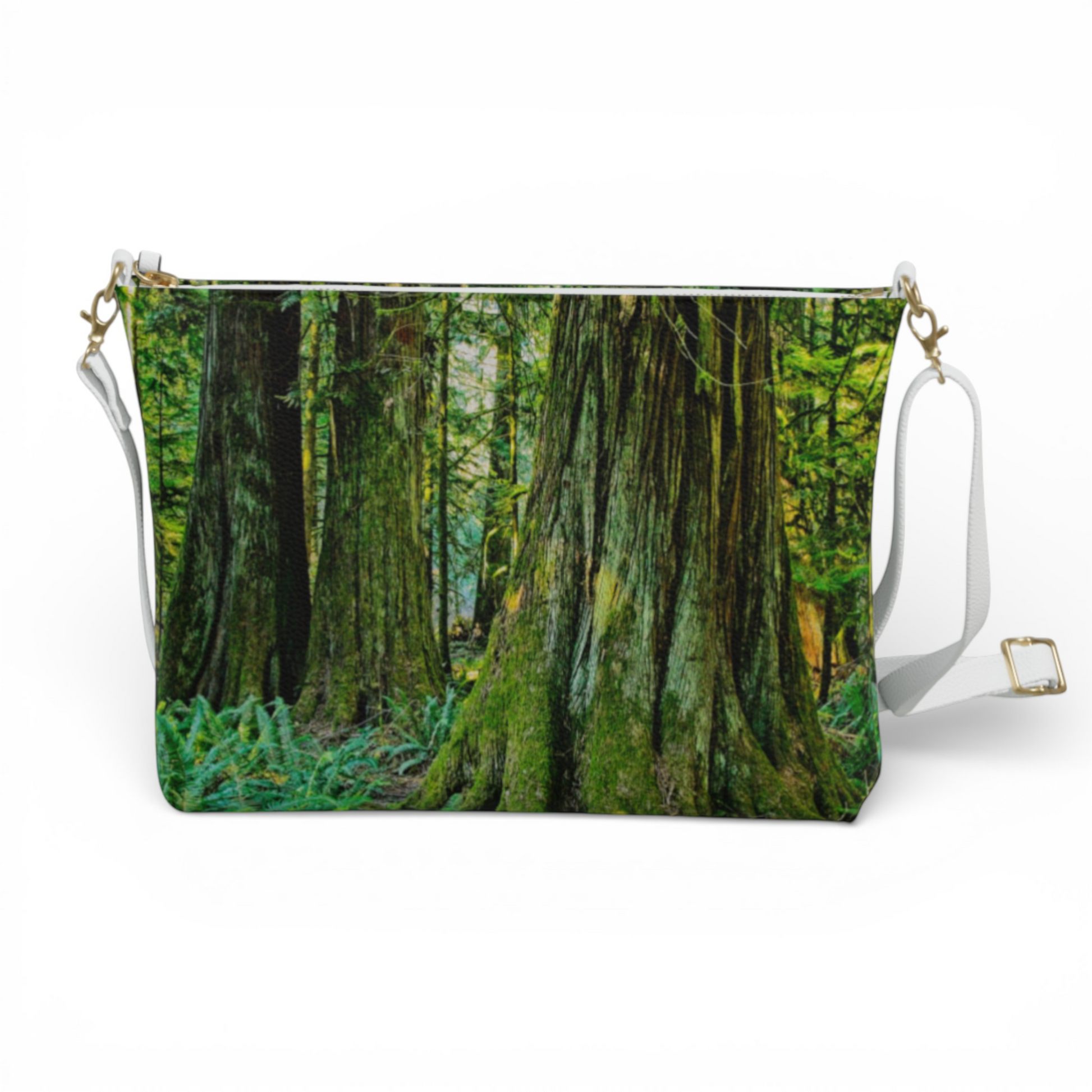 Van Isle Goddess crossbody purse with a forest print, adjustable white strap, and gold hardware.