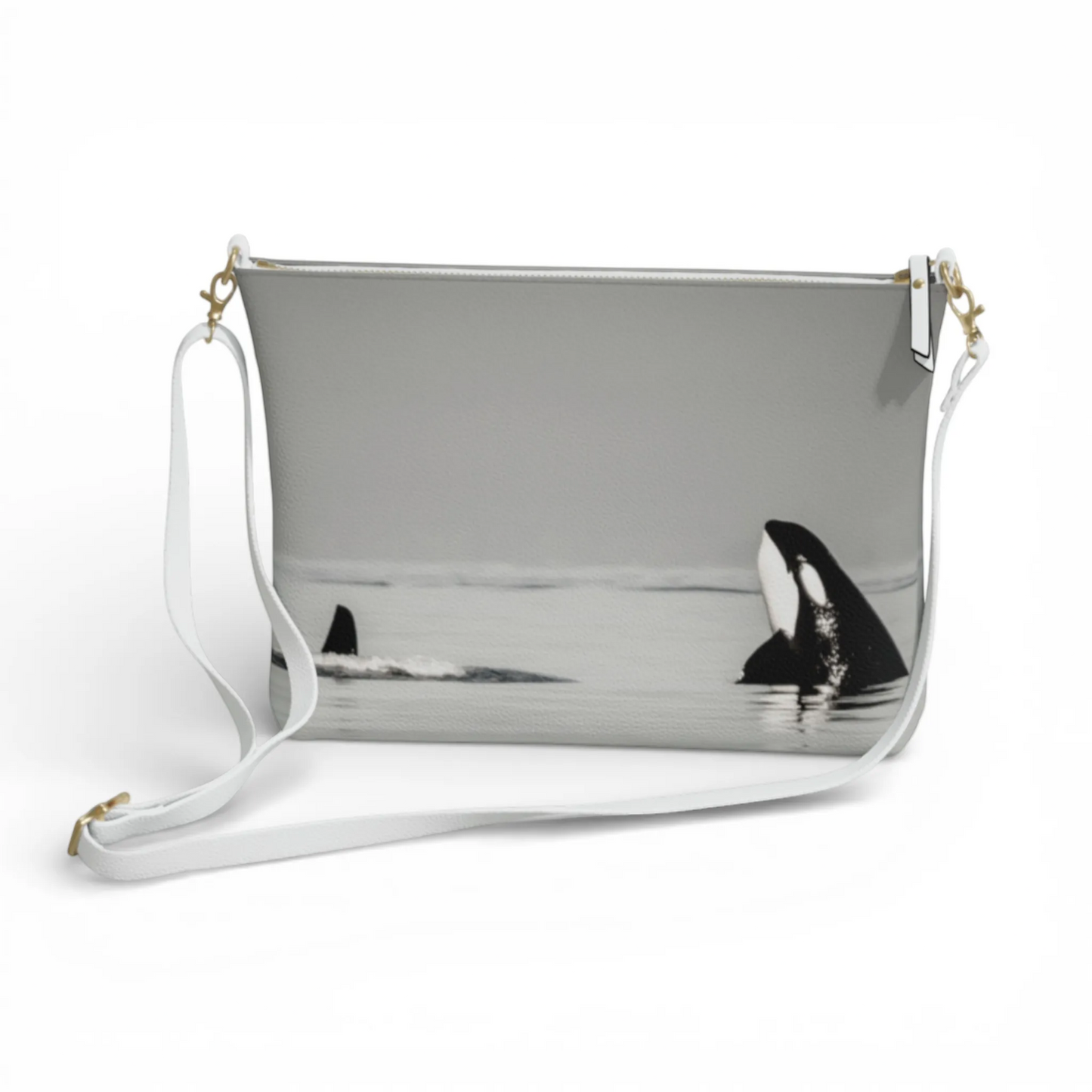Van Isle Goddess Orca Spy Hop crossbody purse in vegan leather with orca whale print and white adjustable strap.