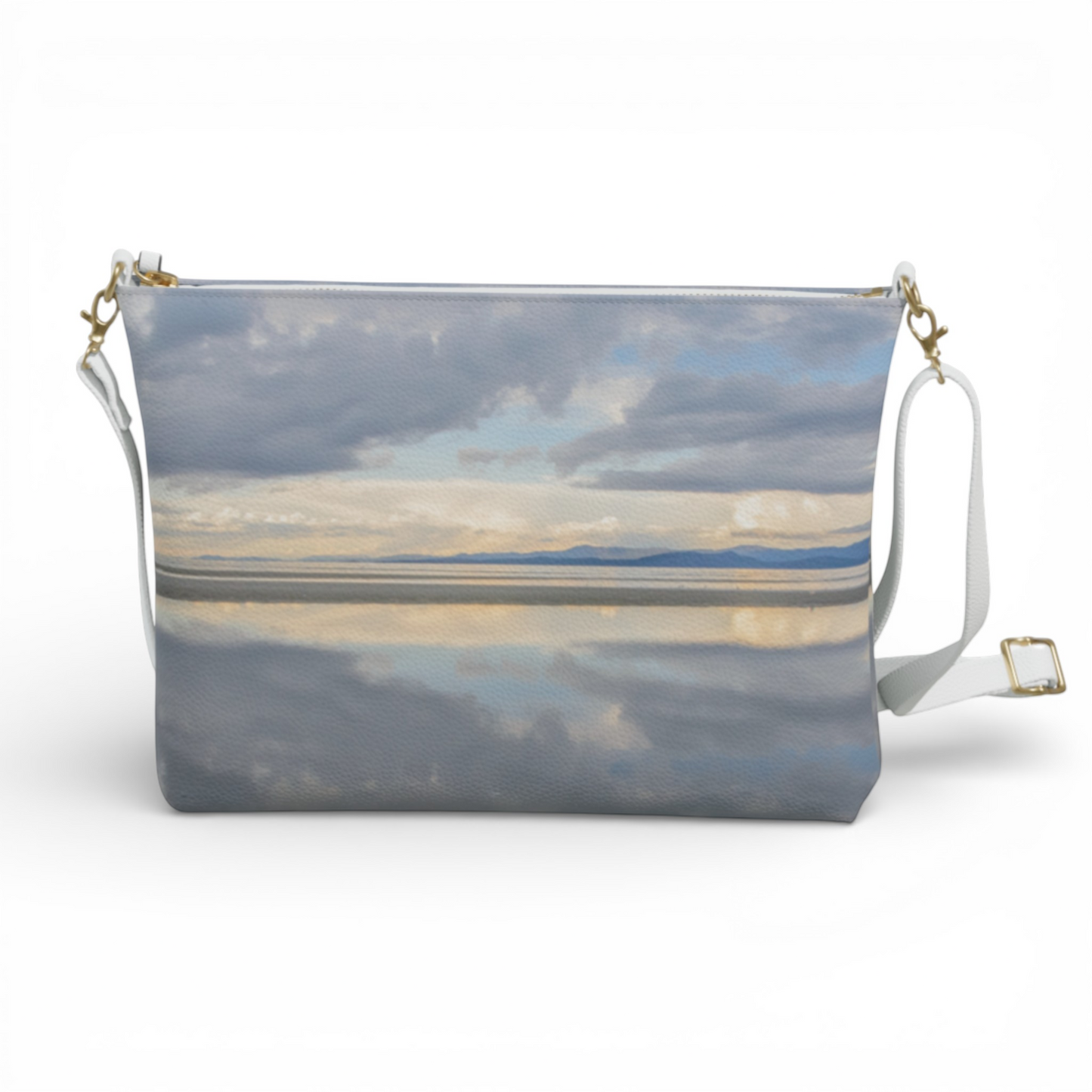 Van Isle Goddess Parksville Beach vegan leather crossbody purse with adjustable white strap and gold hardware, featuring a serene sky and water reflection print.